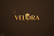 Logo Velora fondo marrón